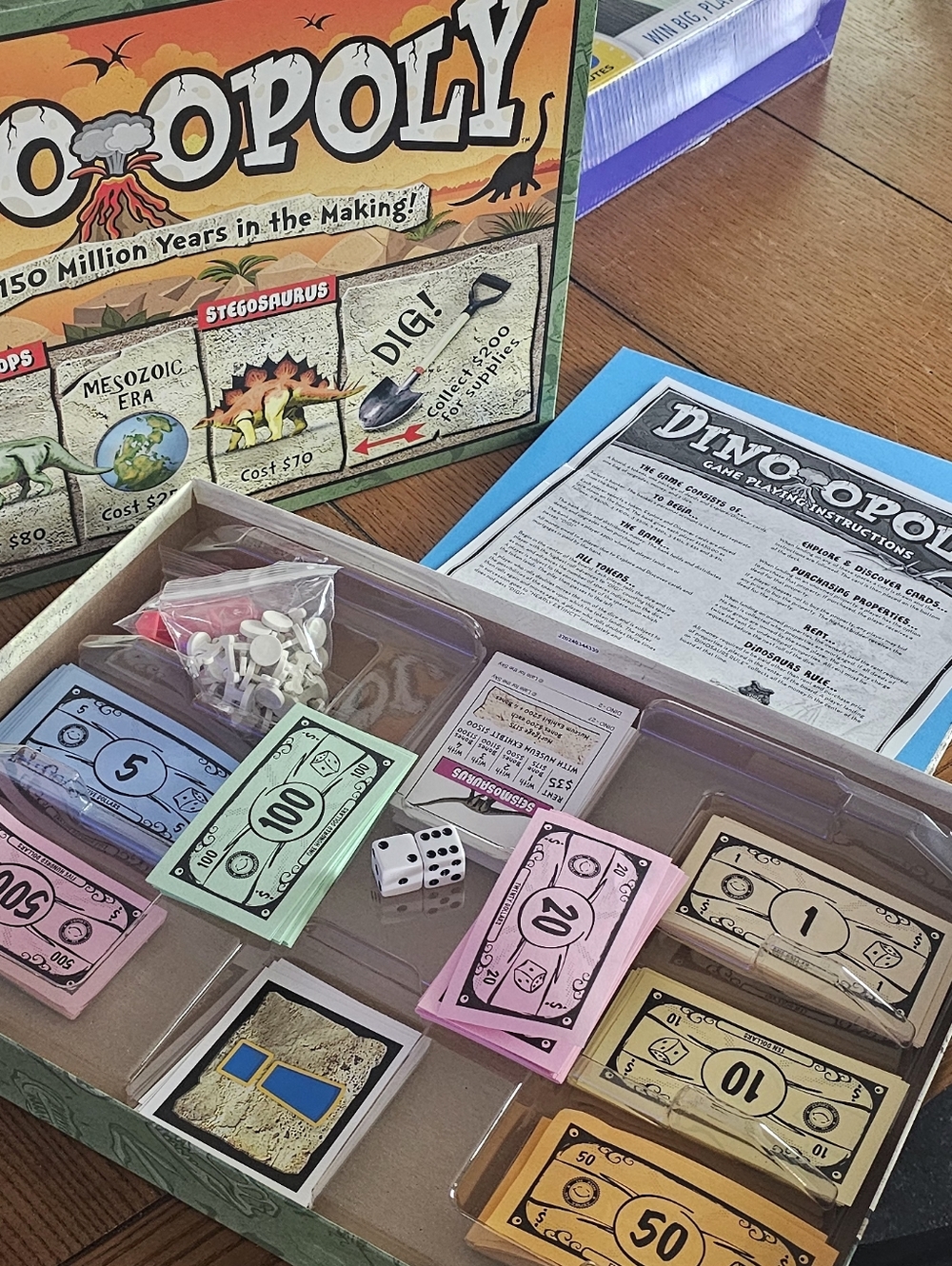 Dino-Opoly Family Board Game - Colorful Play Money Set Included